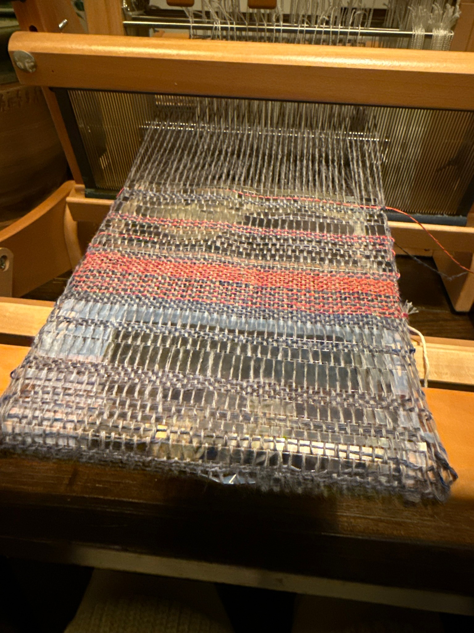 Illustration of small caterpillar amongst branches